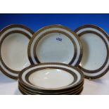 EIGHT VIENNA SOUP PLATES, EACH DECORATED WITH A RUNNING BAND OF PAIRS OF LEAVES GILT ON BLUE RIMS.