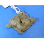 A CHINESE HARDSTONE BI CARVED ON ONE SIDE WITH A DRAGON AND ON THE OTHER WITH A SPIRAL BAND. W