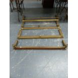 THREE ANTIQUE BRASS RAIL TOP FIRE CURBS AND A BRASS MOUNTED OAK FIRE CURB. (4)