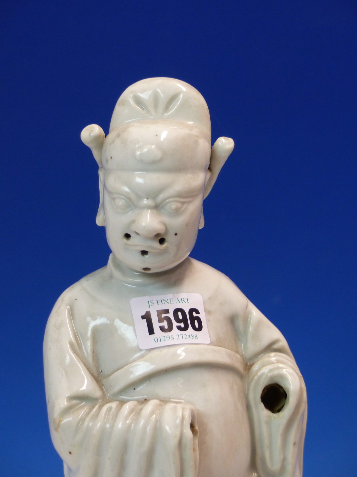 A BLANC DE CHINE FIGURE OF A FIERCE EYED MANDARIN STANDING ON A DOUBLE CLOUD PLINTH, HIS CHIN - Image 2 of 48