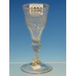 AN 18th C. GERMAN MASONIC WINE GLASS. THE BOWL ENGRAVED WITH A VERSE ON ONE SIDE ABOVE AN ORB, A