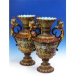 A PAIR OF SCHILLER MAJOLICA TWO HANDLED BALUSTER VASES, THE GIRTH BANDS OF ROMAN WARRIORS ON AN