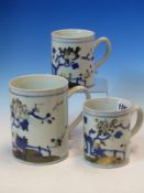A GRADED SET OF THREE NANKING CARGO MUGS, THE FENCED GARDENS OF FLOWERS PAINTED IN NOW DEGRADED