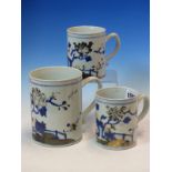 A GRADED SET OF THREE NANKING CARGO MUGS, THE FENCED GARDENS OF FLOWERS PAINTED IN NOW DEGRADED