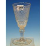 AN 18th C. WINE GLASS, THE CONICAL BOWL ENGRAVED WITH FLOWERS BELOW CHEVRON RIM BAND, ANOTHER ON THE