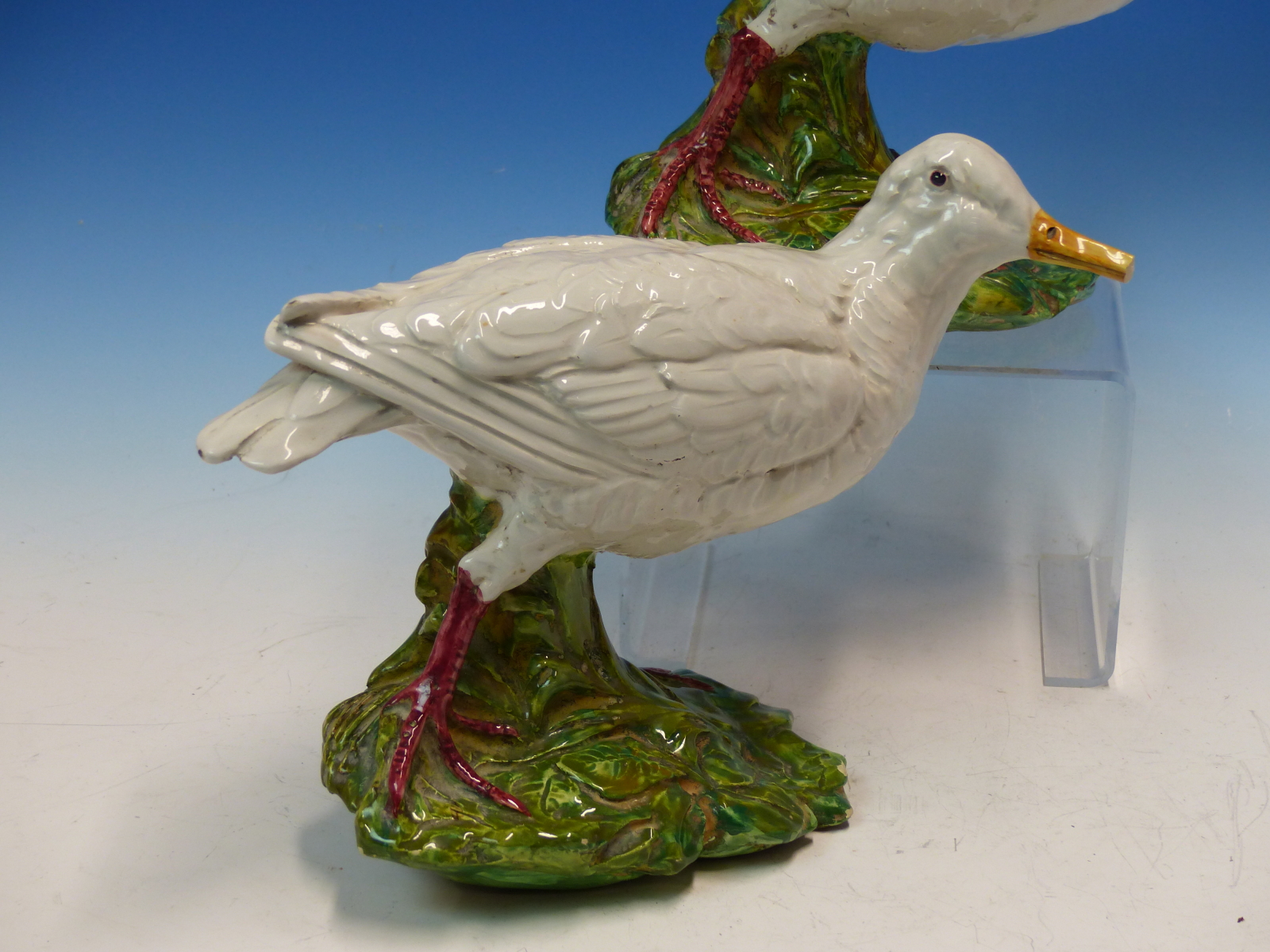 A PAIR OF MAJOLICA WHITE WADING BIRDS WITH LONG YELLOW BEAKS, THEIR RED LEGS ON GREEN FOLIAGE - Image 4 of 11