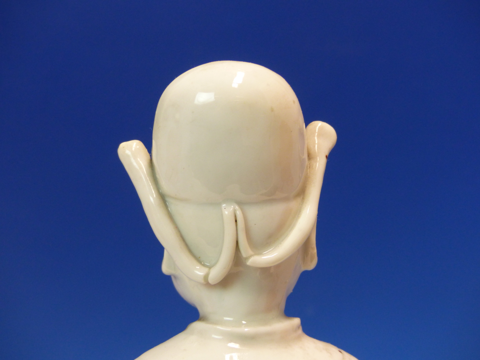 A BLANC DE CHINE FIGURE OF A FIERCE EYED MANDARIN STANDING ON A DOUBLE CLOUD PLINTH, HIS CHIN - Image 12 of 48