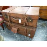 A LARGE VINTAGE LEATHER SUITCASE AND A SIMILAR LEATHER MOUNTED CANVAS EXAMPLE. (2)