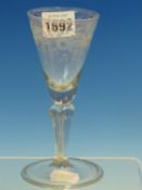 AN 18th C. GERMAN GLASS WITH FLORAL ENGRAVED CONICAL BOWL, HOLLOW SILESIAN STEM AND FOLDED FOOT. H