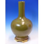 A CHINESE TEA DUST GLAZED BOTTLE VASE, SEAL MARK WITHIN THE FOOT RIM INSIDE AN ORMOLU MOUNT WITH A