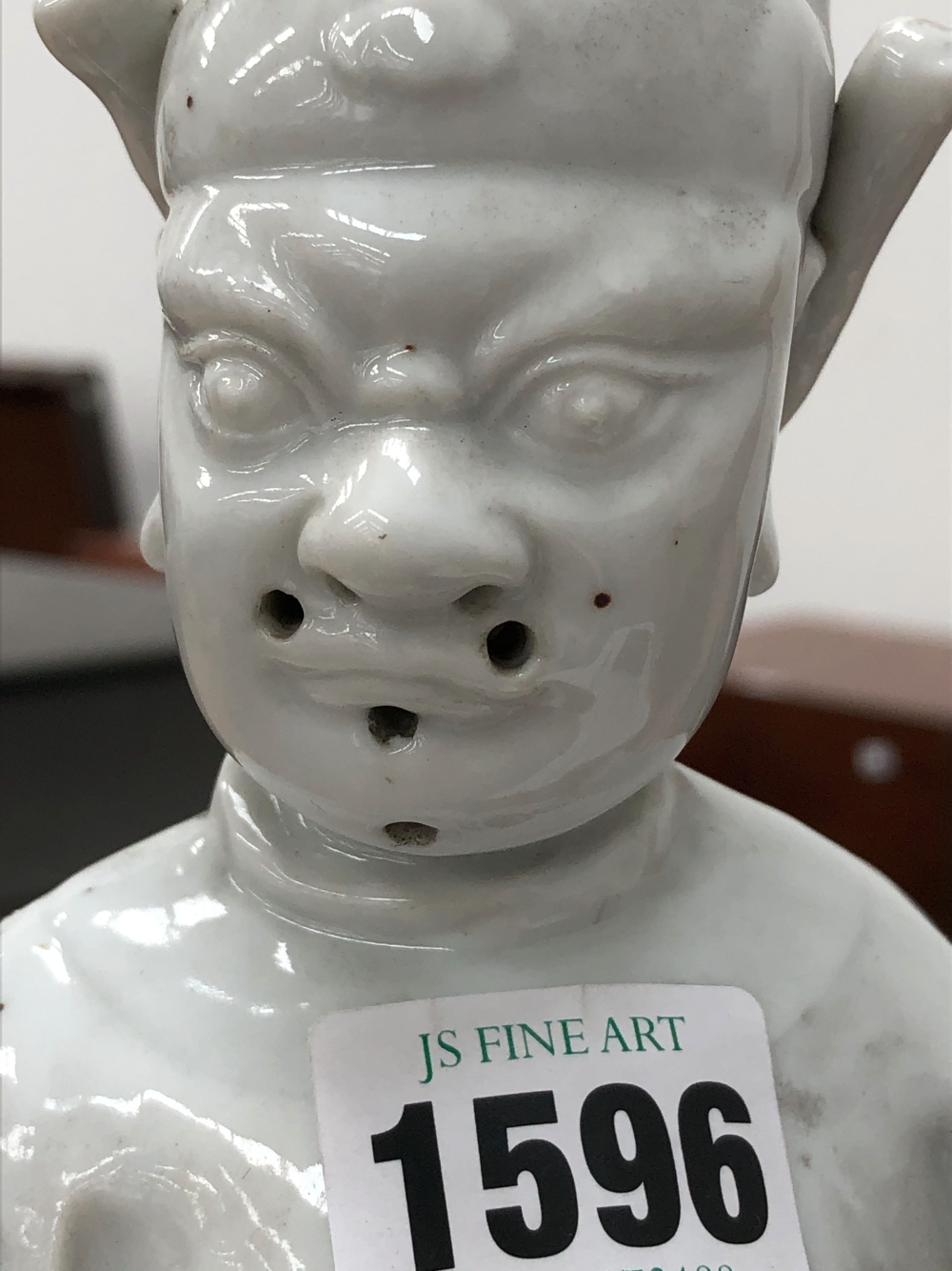 A BLANC DE CHINE FIGURE OF A FIERCE EYED MANDARIN STANDING ON A DOUBLE CLOUD PLINTH, HIS CHIN - Image 33 of 48