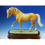 A 1971 ROYAL WORCESTER PALOMINO STALLION MODELLED BY DORIS LINDNER. W 31cms.