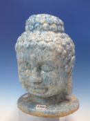 A TURQUOISE MARBLED TERRACOTTA HEAD OF THE BUDDHA MODELLED WITH THIRD EYE AND CURLED HAIR. H 34cms.