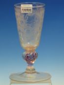 AN 18th C. GERMAN ALE GLASS, THE BOWL CUT AND ENGRAVED WITH FLOWERS ABOVE A RED TWIST BALUSTER