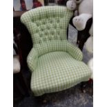 A VICTORIAN BUTTON BACK LADIES CHAIR IN GREEN CHECK UPHOLSTERY.