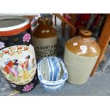 A STONE WARE FLAGON INSCRIBED J.W. COURT & SONS, ANOTHER FLAGON, AN ORIENTAL STYLE STICK STAND AND