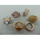 A GROUP OF SIX SILVER GILT AND GEM SET RINGS, FINGER SIZE RANGE L-M 1/2. GROSS WEIGHT 42.9grms.