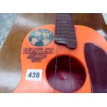 A VINTAGE BEATLES BIG SIX GUITAR AND STAND.