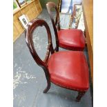 A SET OF FOUR VICTORIAN BALLOON BACK DINING CHAIRS.