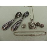 A SILVER OPEN WORK PENDANT, A PAIR OF SILVER AND MARCASITE CLIP ON EARRINGS, A SILVER LOCKET AND