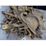 A CARVED WOOD GILT WALL PLAQUE.