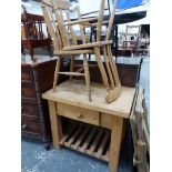 A PINE KITCHEN PREP TABLE AND TWO CHAIRS.