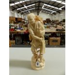 A LARGE JAPANESE 19TH C. CARVED IVORY FIGURE OF A FISHERMAN HOLDING A NET OVER HIS BACK. H. 46cms.