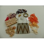 COSTUME JEWELLERY TO INCLUDE BEADS AND BROOCHES, AN ELEGANCE EVANS GILDED EVENING CLUTCH, AND A