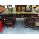 A REPRODUCTION MAHOGANY PEDESTAL DESK.