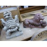 TWO POTTERY FIGURES A LION AND A DRAGON GROTESQUE.