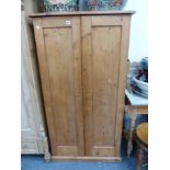 A SMALL ANTIQUE PINE HALL CABINET.