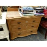 AN ANTIQUE PINE THREE DRAWER CHEST.