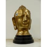 A LARGE FAR EASTERN STYLE HEAD OF A BUDDHA.