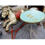A MOBO TIN ROCKING HORSE AND A SMALL RETRO TABLE.