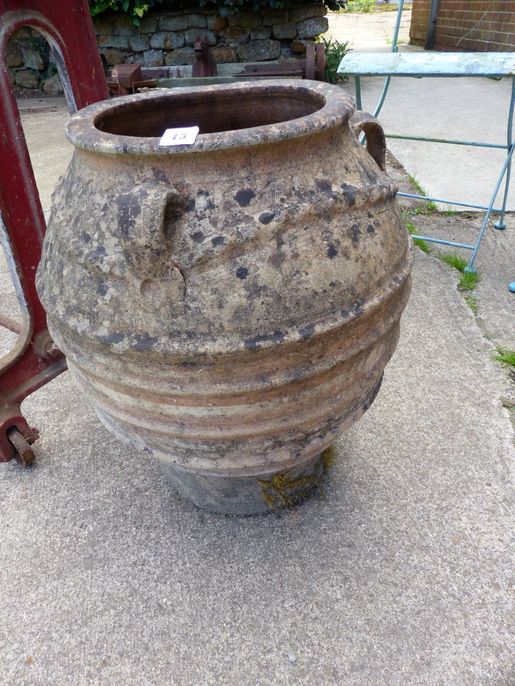 A TERRACOTTA URN.