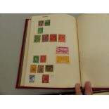 A VINTAGE STRAND STAMP ALBUM AND CONTENTS TOGETHER WITH LOOSE STAMPS AND AN EMPTY ALBUM.