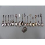 A SILVER VESTA, VARIOUS SILVER AND WHITE METAL DECORATIVE SPOONS TO INCLUDE APOSTLES, ORIENTAL
