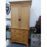 A VICTORIAN PINE LINEN PRESS OF SMALL PROPORTIONS.