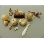THREE ANTIQUE CARVED IVORY FRUITS, A FIGURE OF A RECUMBENT OX ETC.