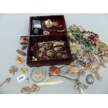 A COLLECTION OF COSTUME JEWELLERY TO INCLUDE BEADS, BANGLES, BROOCHES ETC.