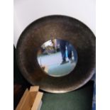 A LARGE CONTEMPORARY ROUND MIRROR.