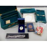 A GREEN LEATHER JEWELLERY CASE, A HALCYON DAYS ENAMEL BOX, VARIOUS BADGE AND MEDALS, A GOLD AND