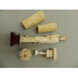 AN ANTIQUE IVORY ORIENTAL PUZZLE BALL, TWO DIE SHAKERS, AND A TALL FIGURE.