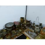 AN EXTENSIVE COLLECTION OF COPPER AND BRASSWARES TO INCLUDE, KETTLES OIL LAMPS, CANDLESTICKS,