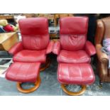 A PAIR OF EKORNES RECLINING SWIVEL ARM CHAIRS WITH MATCHING STOOLS.