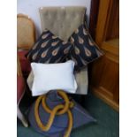 A BUTTON BACK CHAIR AND FOUR CUSHIONS AND ROPE BANISTER.
