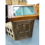 A WALNUT CORNER CABINET AND A GEORGIAN OAK CORNER CABINET.