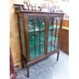 AN EDWARDIAN MAHOGANY DISPLAY CABINET.