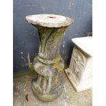 A CARVED STONE BIRDBATH/SUNDIAL BASE.