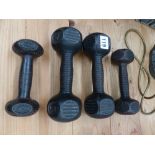 FOUR VINTAGE DUMB BELLS.